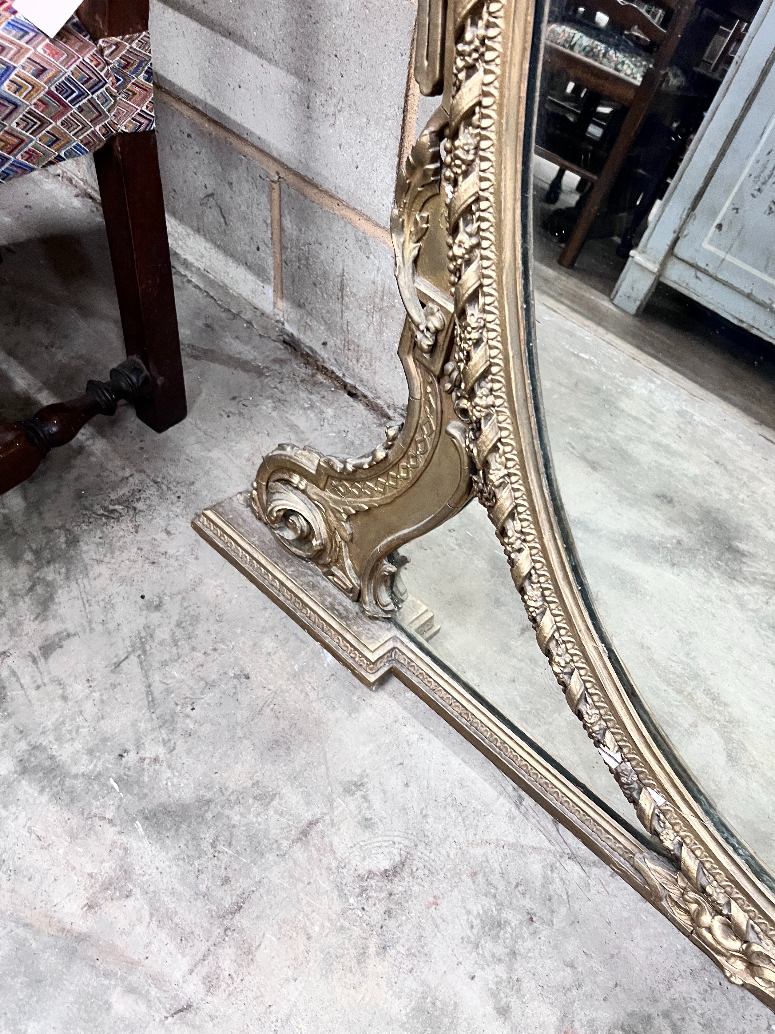 A late Victorian gilt gesso overmantel mirror, width 144cm, height 150cm *Please note the sale commences at 9am.